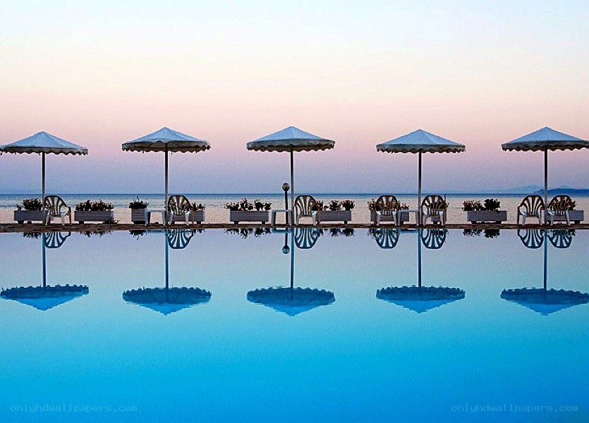 Poolside umbrellas at dusk