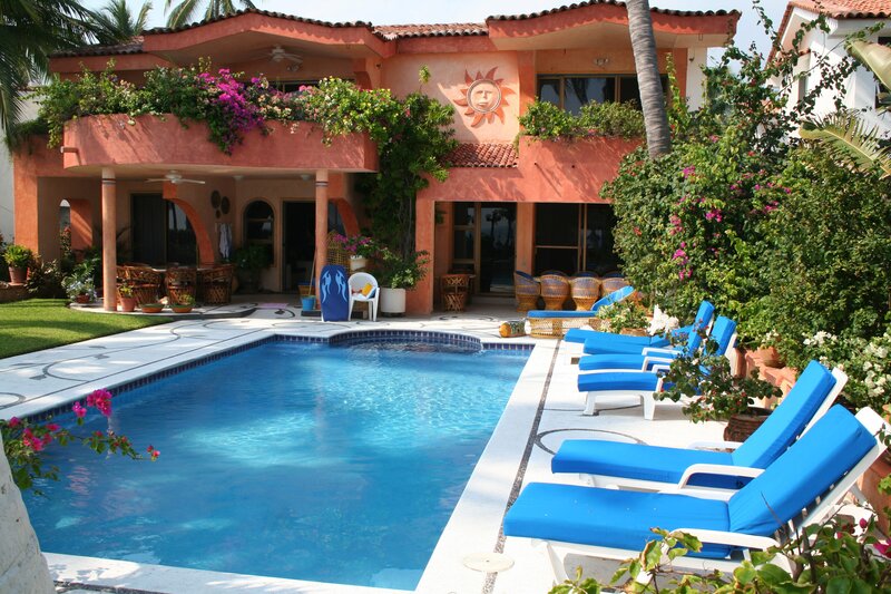 poolside villa with lounge chairs