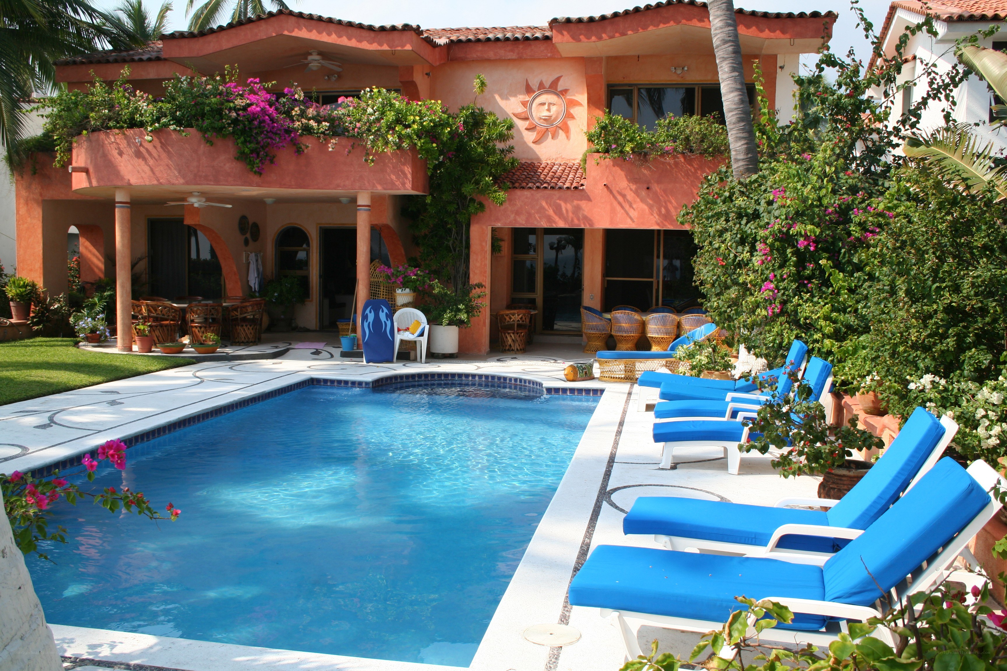 poolside villa with lounge chairs