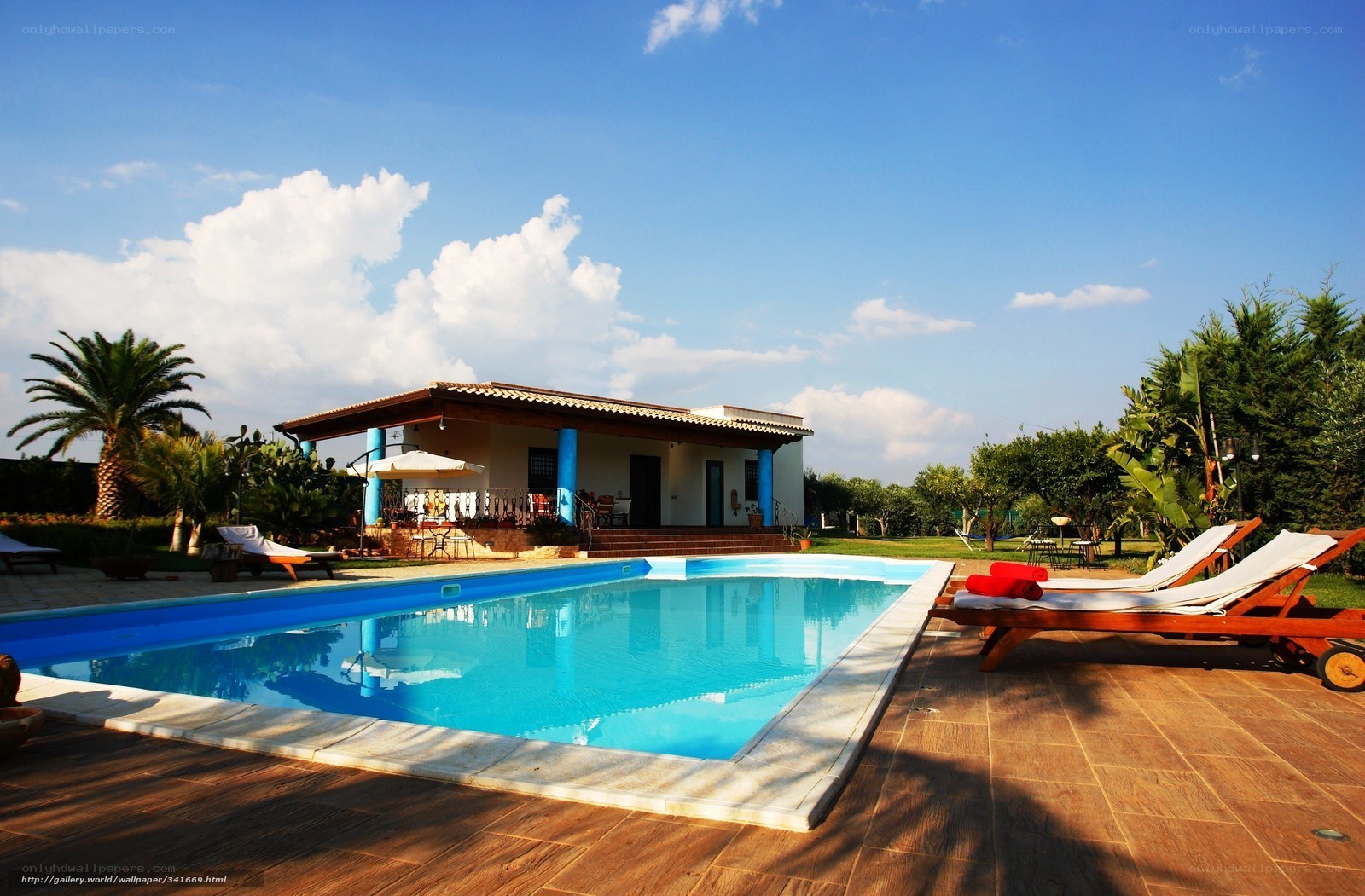 Poolside villa with lounge chairs
