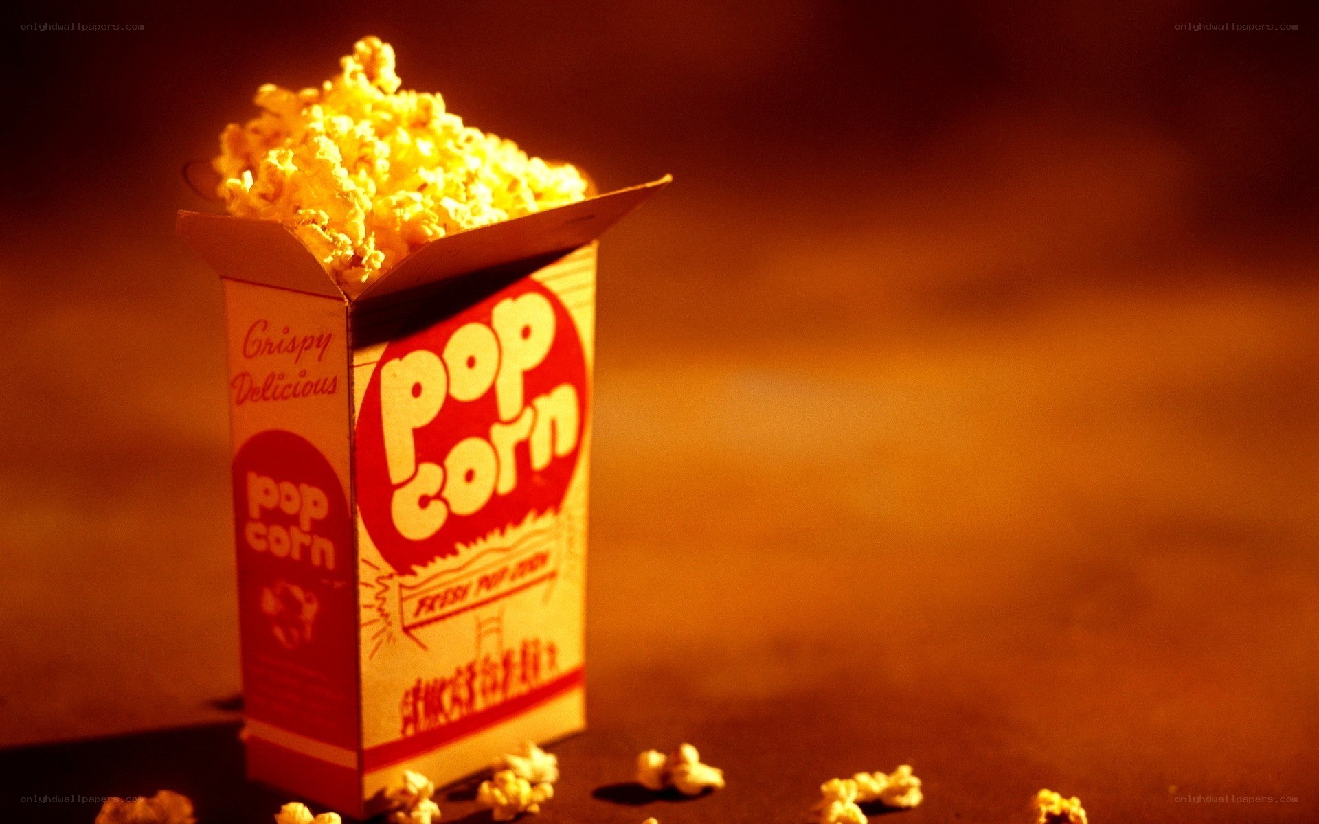 Popcorn box with spilled kernels