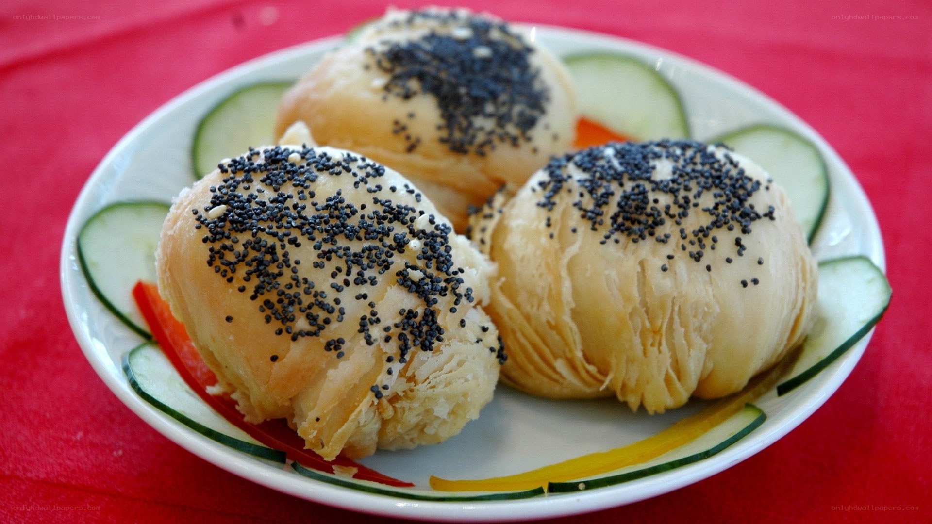 poppy seed buns on a plate