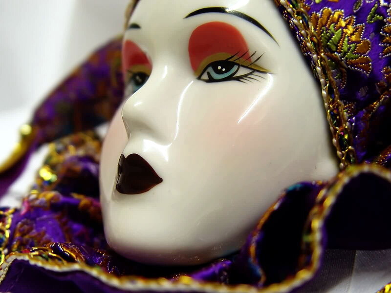 porcelain doll with theatrical makeup