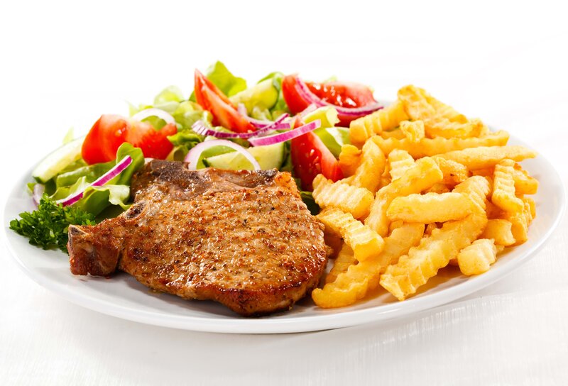 Pork chop with fries and salad