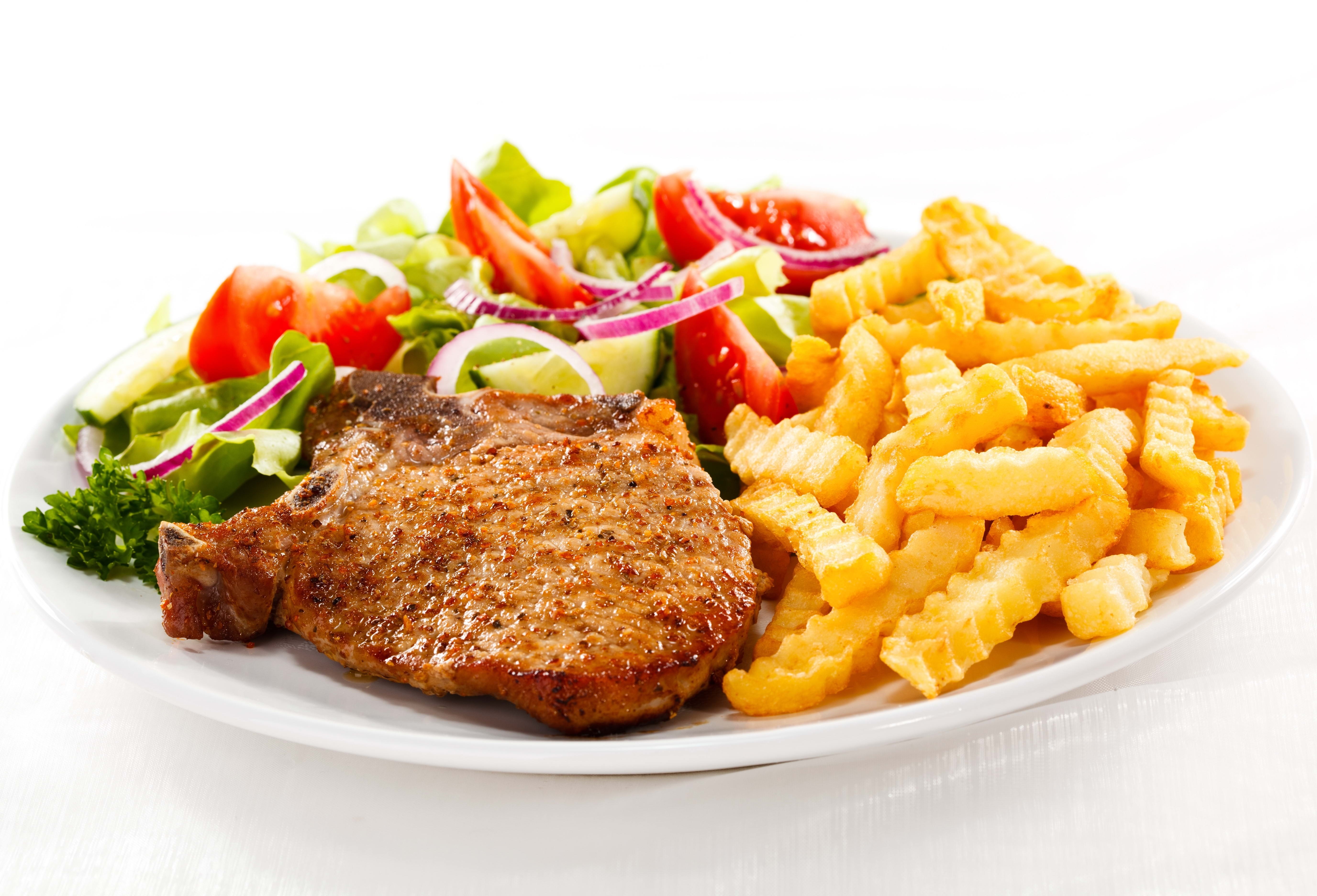 Pork chop with fries and salad
