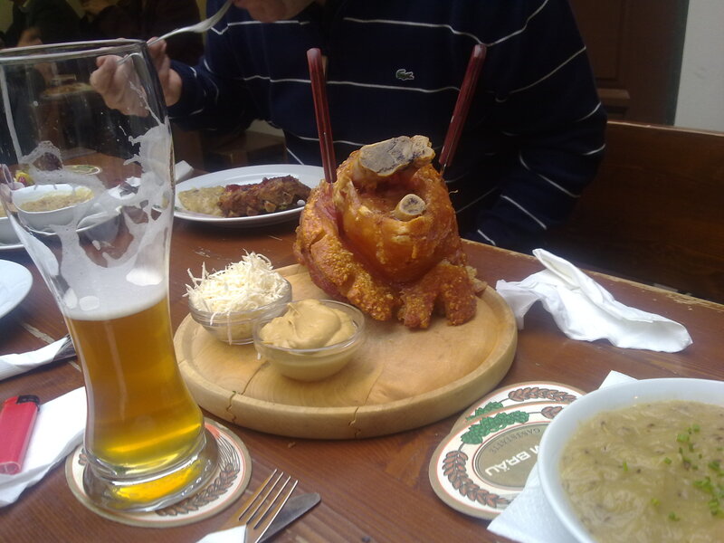 Pork knuckle with beer and sides