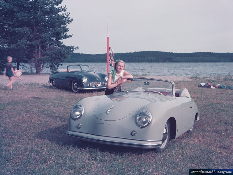 Porsche 356 cars by a lake
