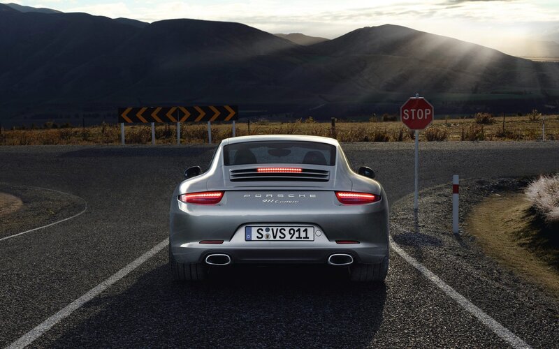 Porsche 911 Carrera on a winding road