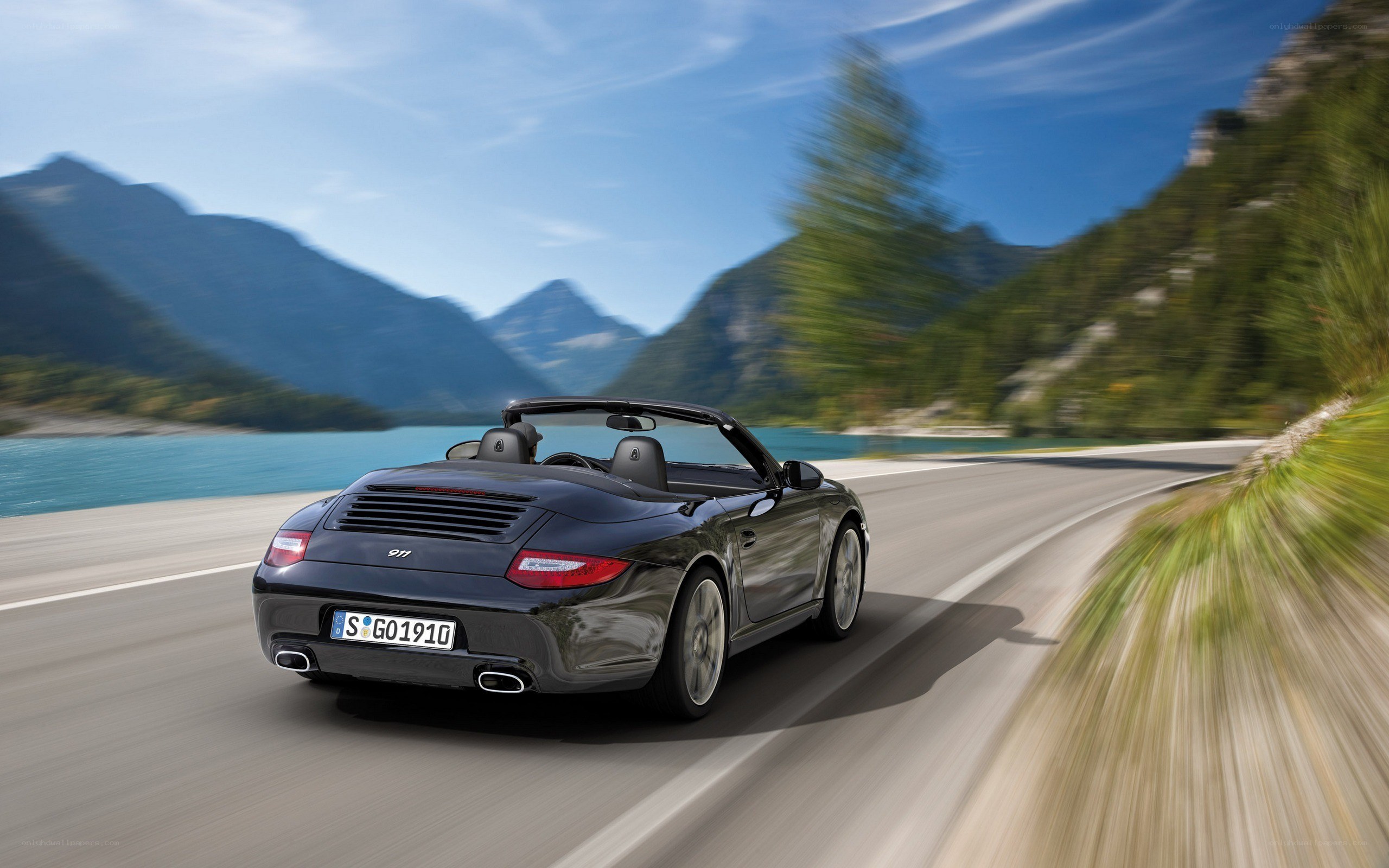 Porsche 911 convertible on mountain road