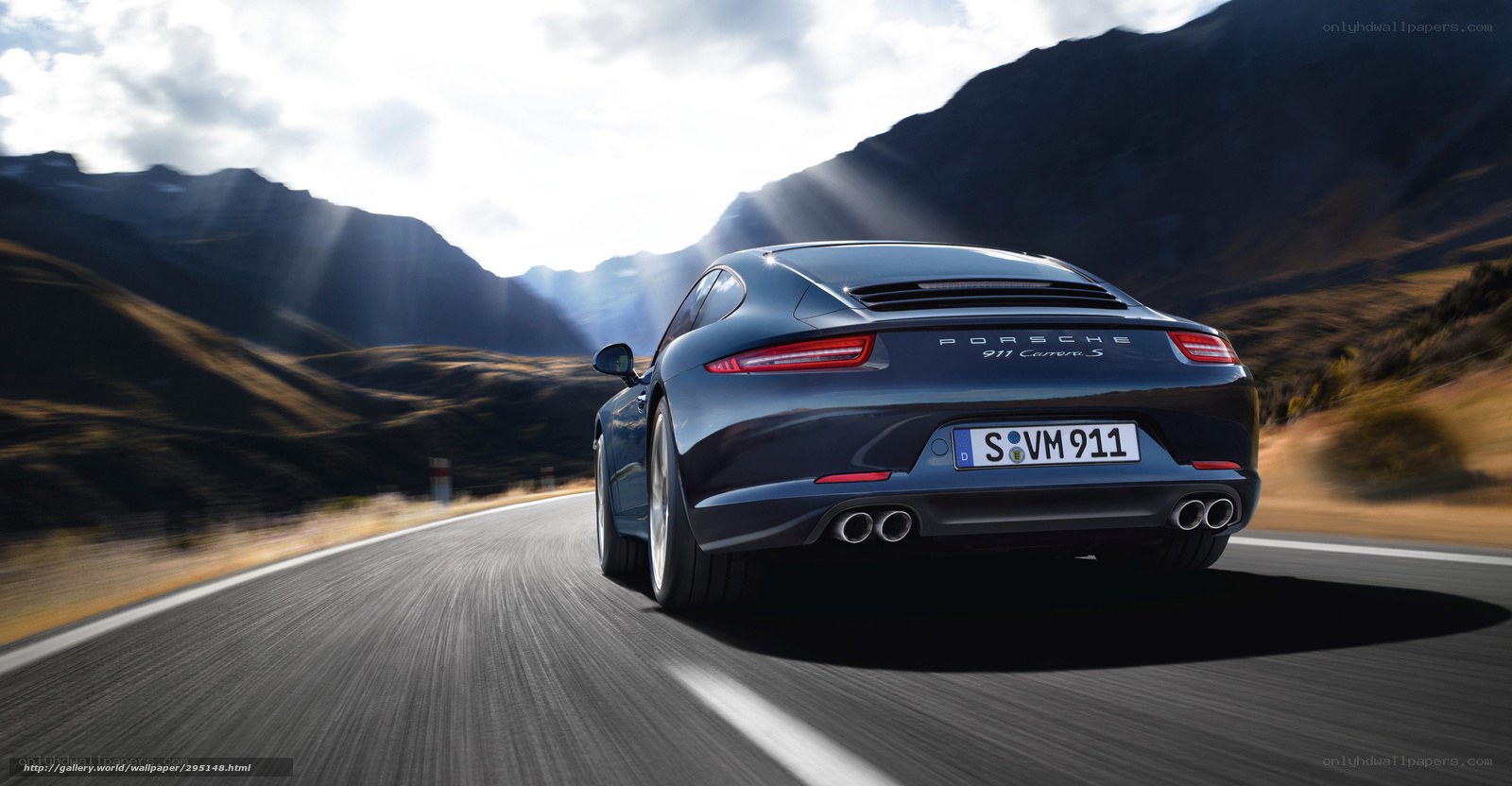Porsche 911 driving on mountain road