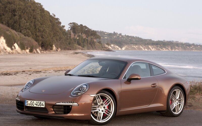 Porsche 911 on a coastal road