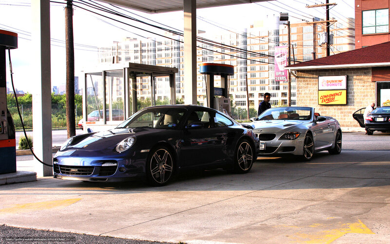 Porsche and BMW at gas station