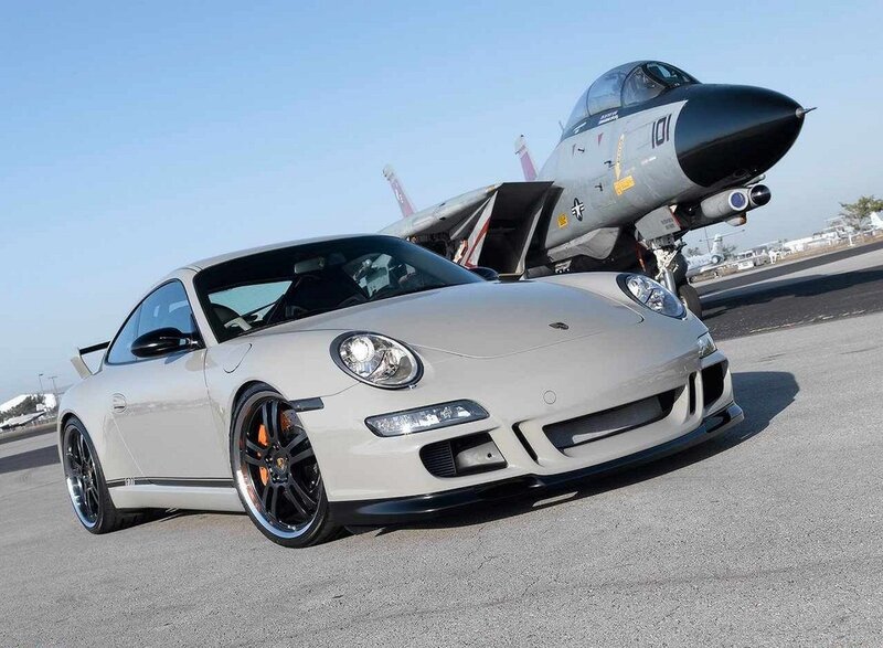 Porsche and fighter jet on tarmac