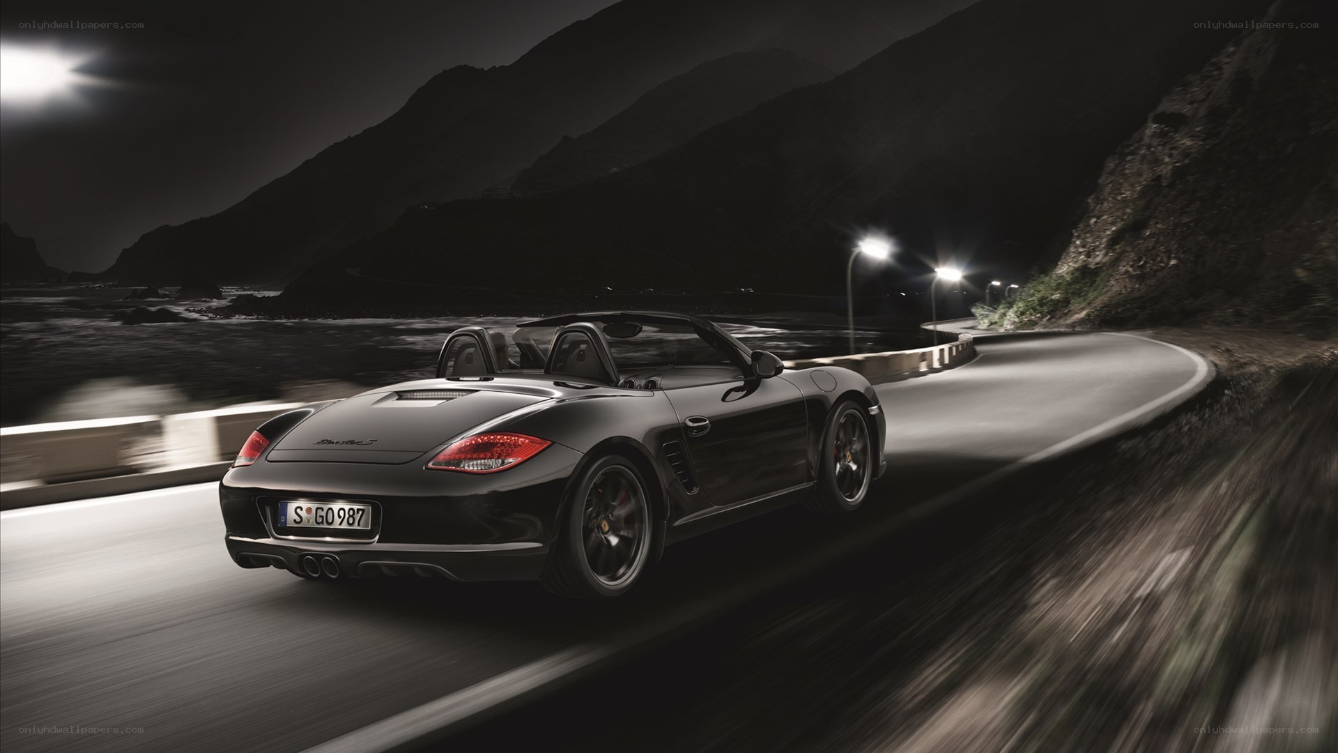 Porsche Boxster driving at night