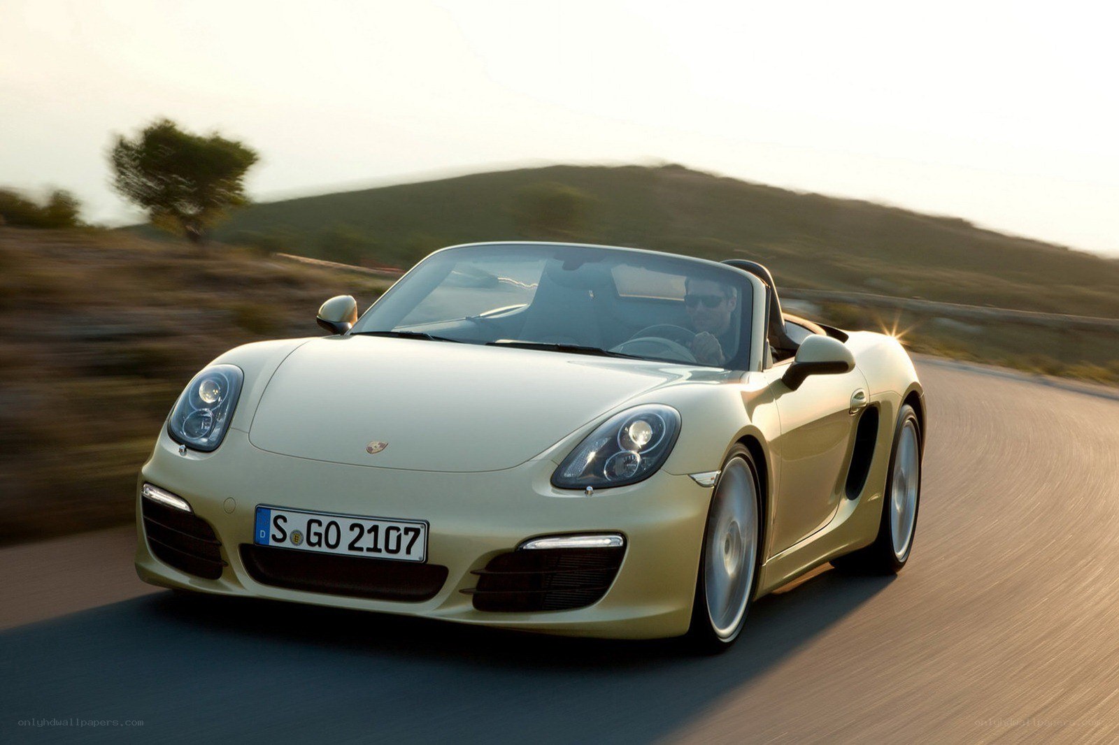 Porsche Boxster driving on a road