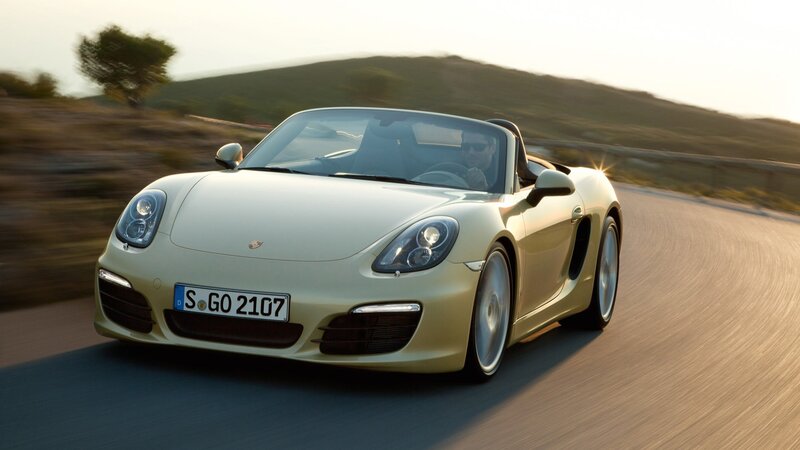 Porsche Boxster driving on a road