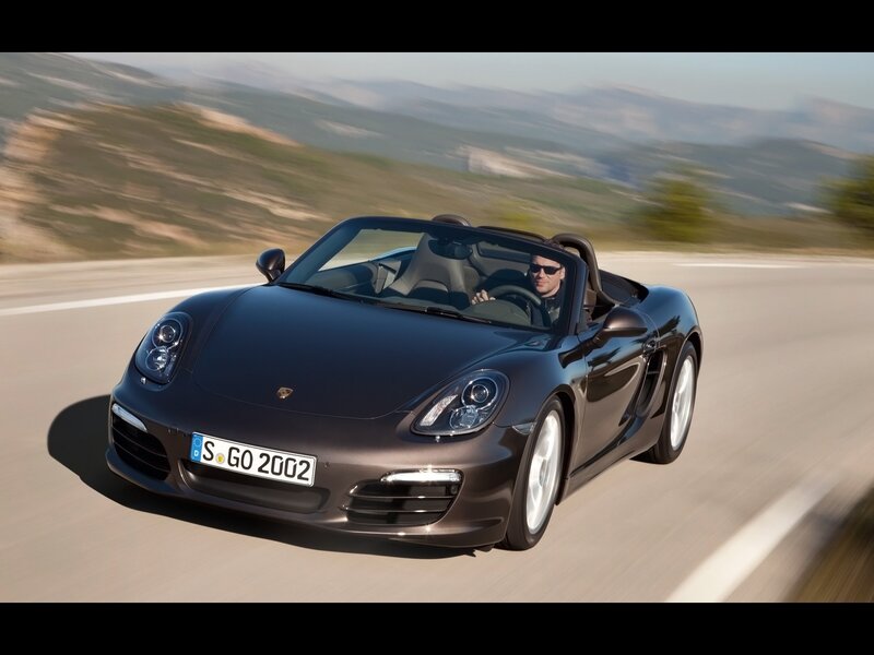 Porsche Boxster driving on a road