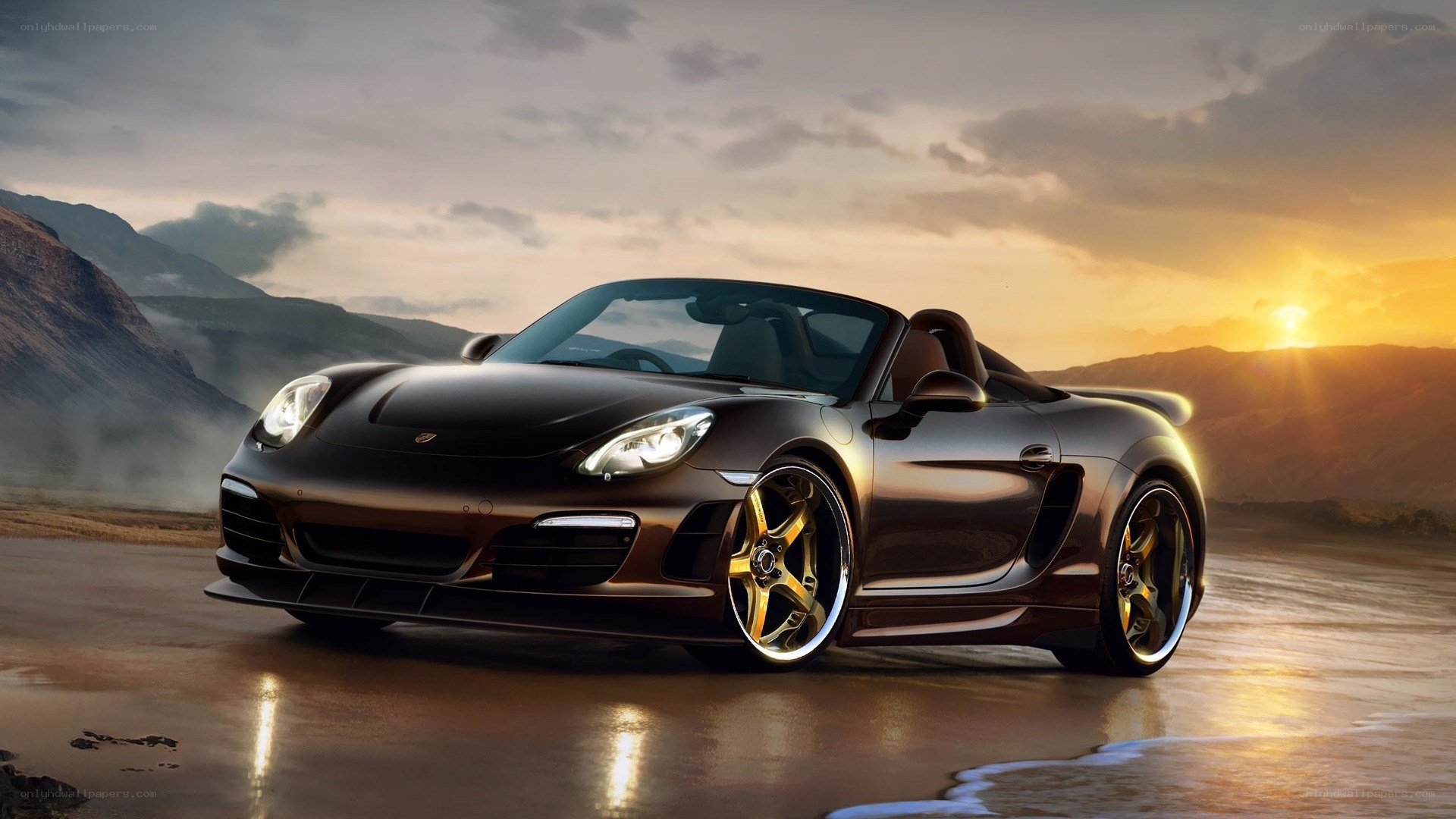 Porsche Boxster on a beach at sunset