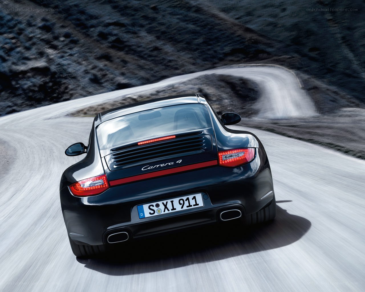 Porsche Carrera 4 on winding road