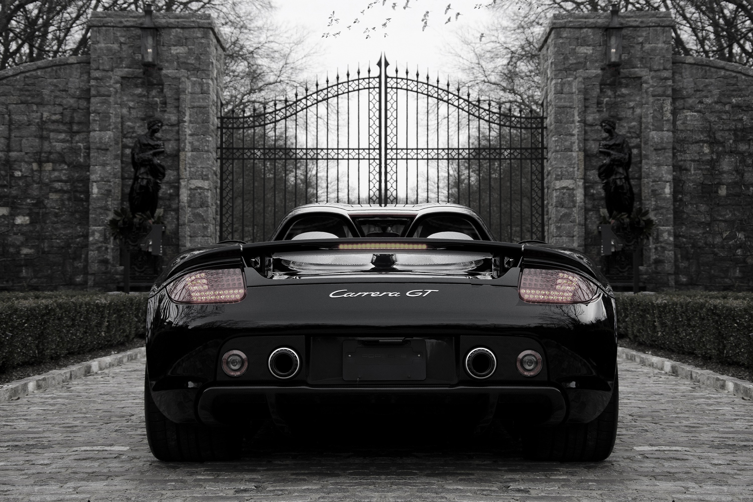 Porsche Carrera GT at stone gate
