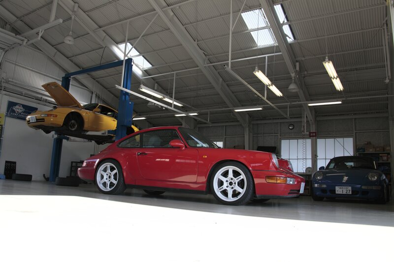Porsche cars in a garage