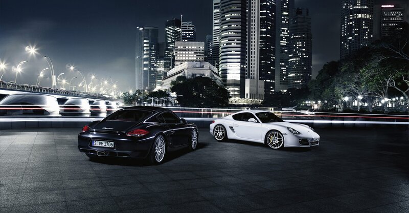 Porsche cars in city at night