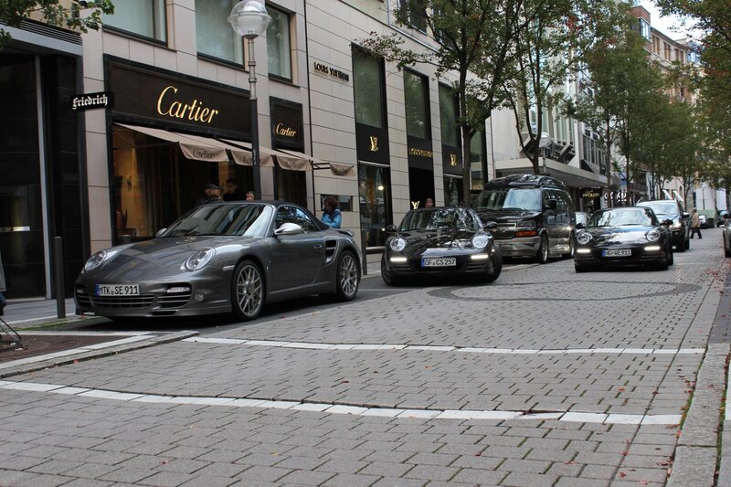 Porsche cars on a city street