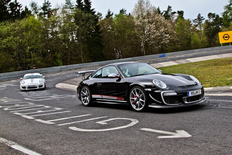 Porsche cars on a racetrack