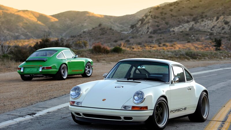 Porsche cars on a road