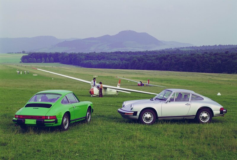 Porsche cars on airfield