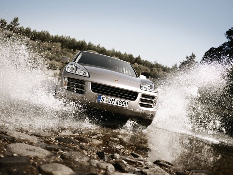 Porsche Cayenne crossing a stream