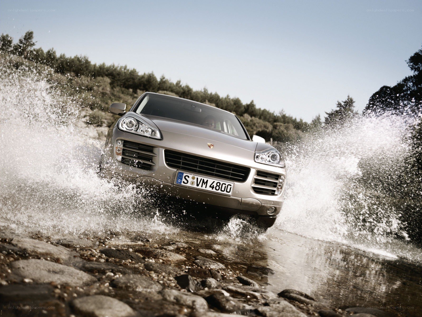 Porsche Cayenne crossing a stream