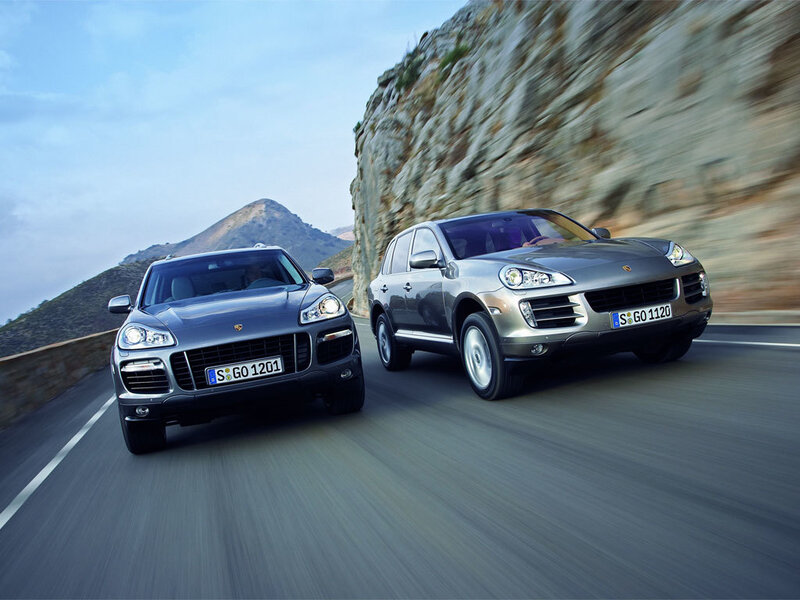 Porsche Cayenne driving on mountain road