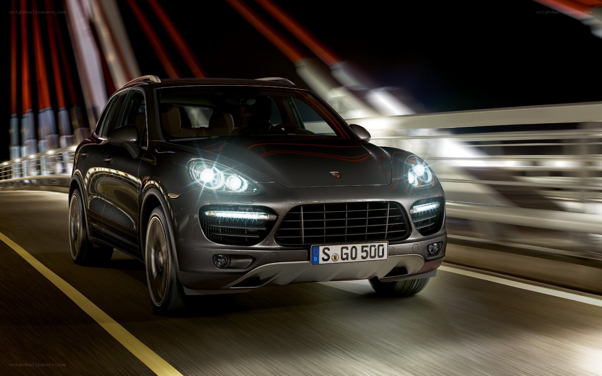 Porsche Cayenne in motion at night