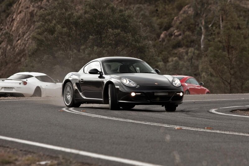 Porsche Cayman on a winding road