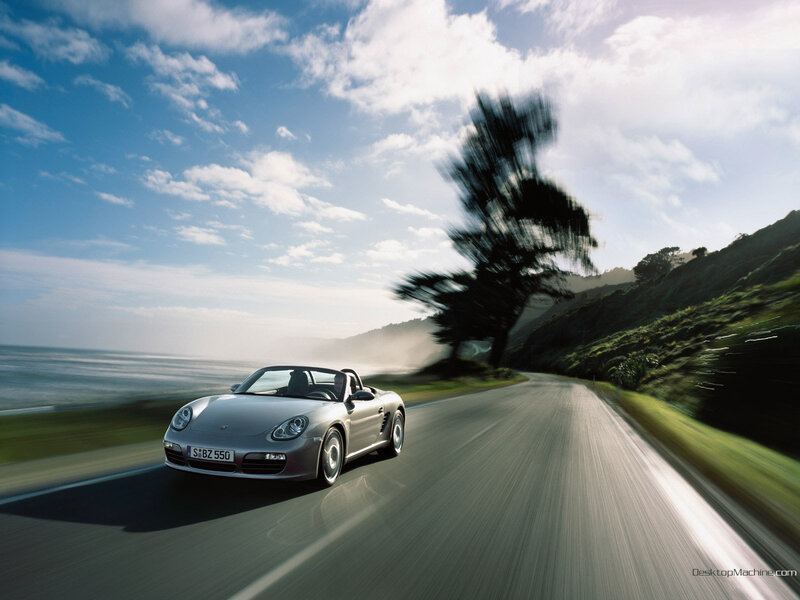 Porsche convertible on coastal road