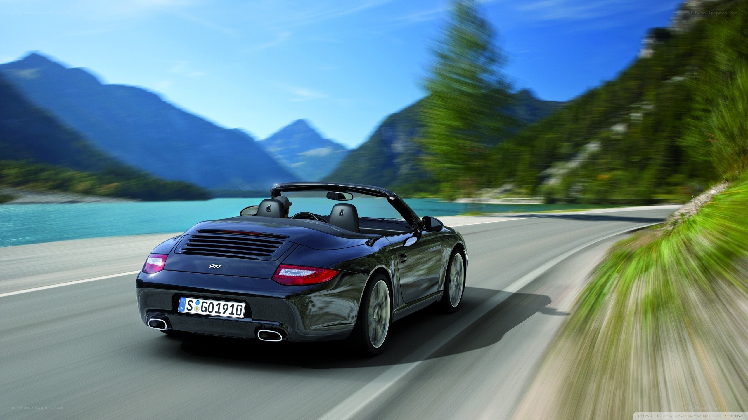 Porsche convertible on mountain road