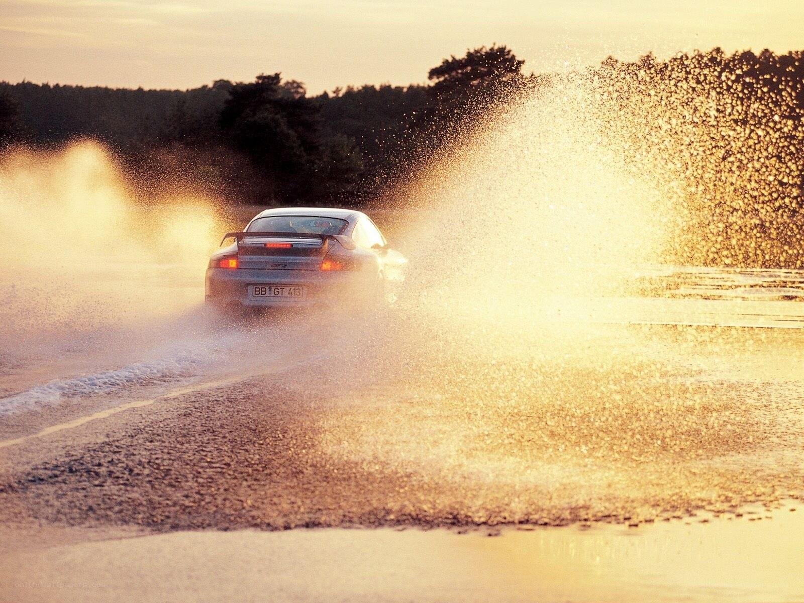 Porsche drifting in water spray