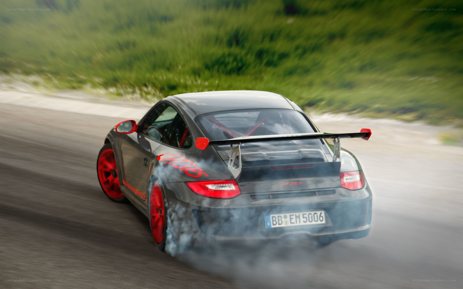 Porsche drifting on track