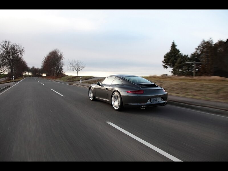 Porsche driving on a country road
