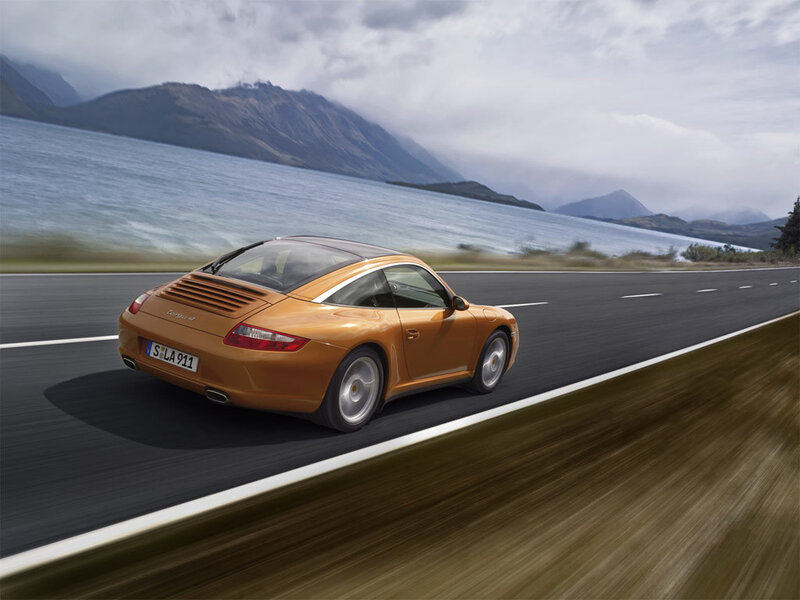 Porsche driving on a scenic road