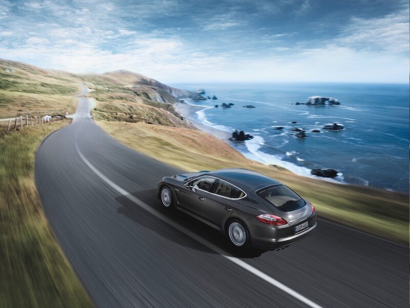 Porsche driving on coastal road