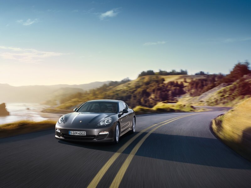 Porsche driving on coastal road