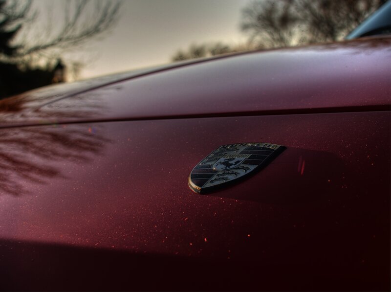 Porsche emblem on car hood