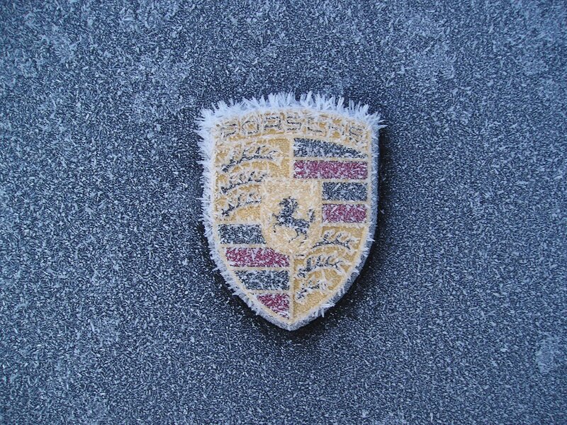 Porsche emblem on frosty surface