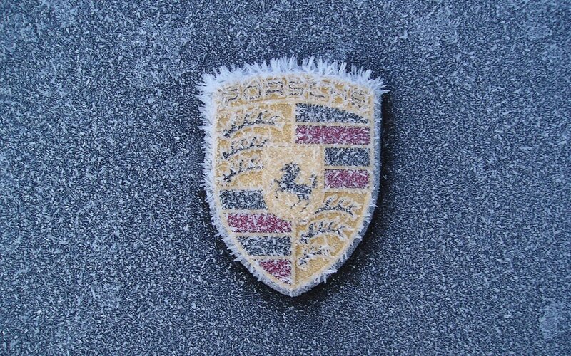 Porsche emblem on frosty surface