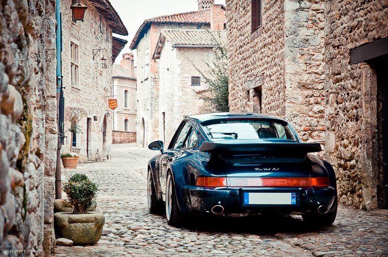 Porsche in a cobblestone alley