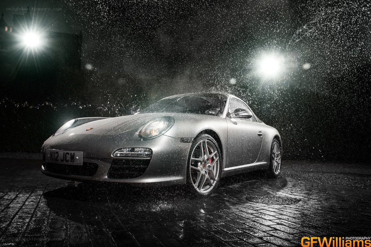 Porsche in rain at night