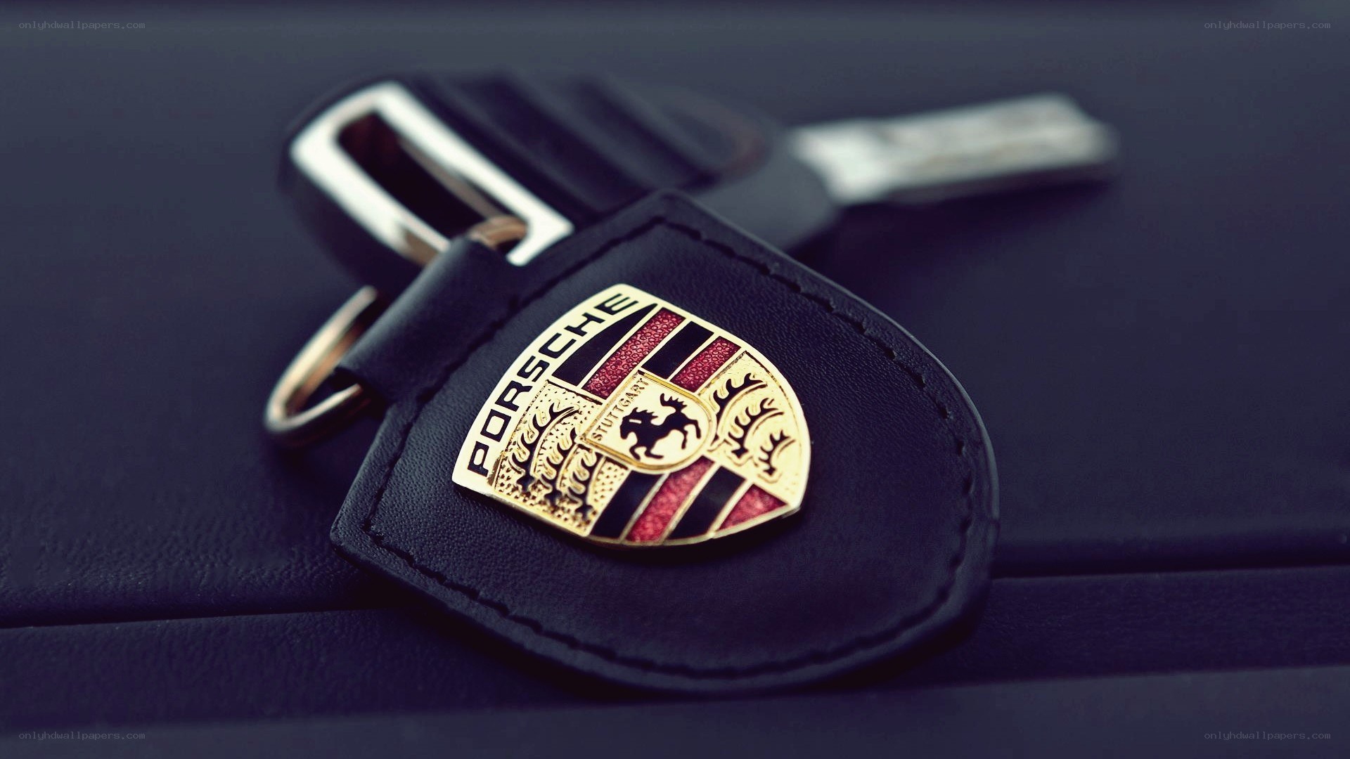Porsche keychain on leather