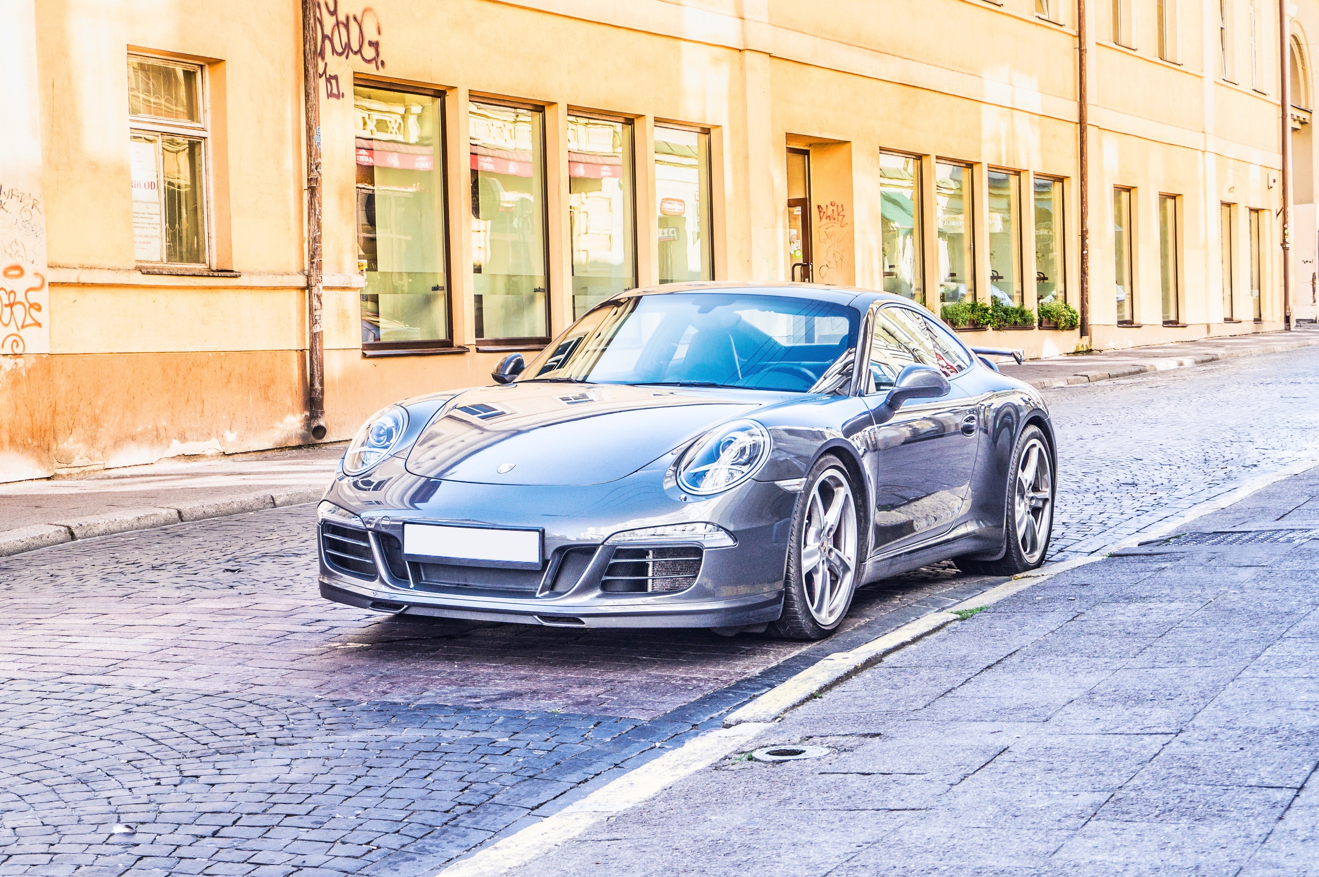 Porsche on a cobblestone street